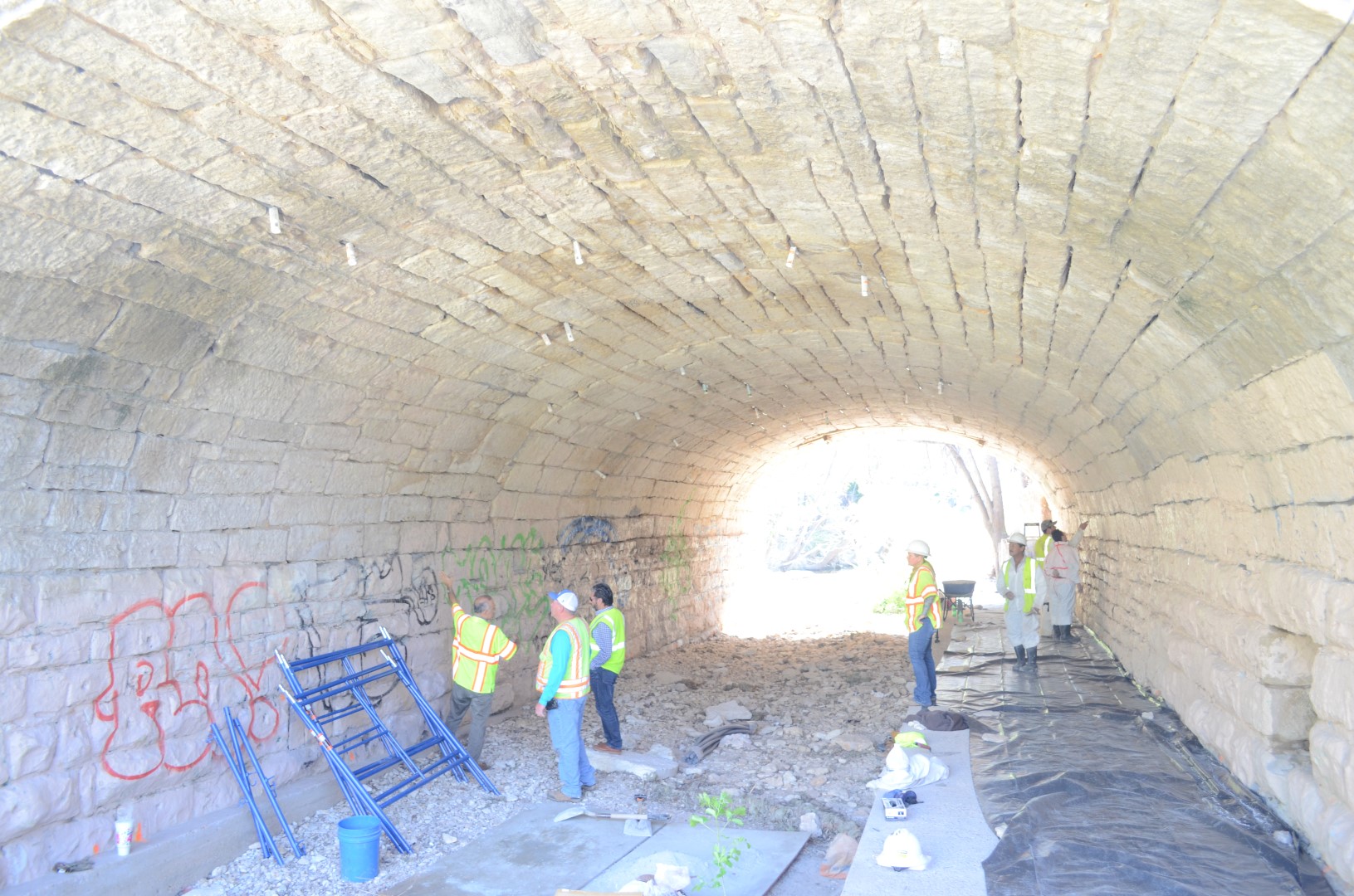 Inside arched bridge where bat exclusion work is performed